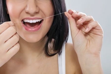 Flossing removes plaque from between teeth and gums and prevents tooth decay, says Manassas general dentist.